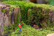 miniature figurine photographer in forest