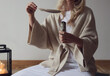 Woman holding white sage stick. Woman holding white sage stick and feather close up