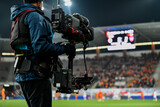 Fototapeta Sport - Cameraman behind playing field during soccer match.