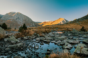 Sticker - River crossing a valley with a mountain in the background