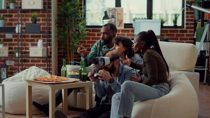 Wall Mural - Diverse group of people losing video games with vr headset, using tv console and virtual reality glasses to play online challenge. Feeling sad and frustrated about lost competition. Handheld shot.