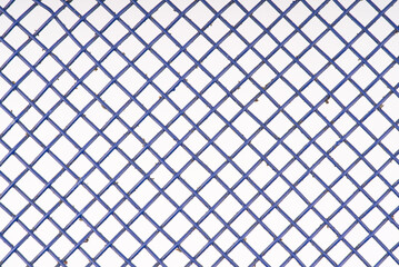 The texture in the form of a blue metal mesh. Macro