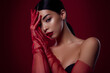 © Beauty Hero - Portrait of magnificent lady wearing red hand accessories black bra look attractive isolated on maroon color background