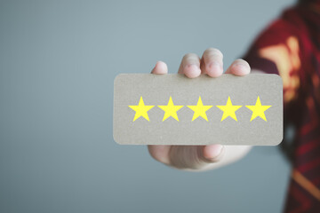 Hand showing five star excellent rating. The best excellent business services rating customer experience, Evaluation, Satisfaction, Feedback, Review concept.