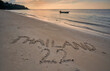 Writing in sand at a beach Thailand 2022