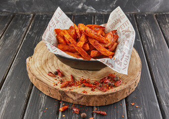 Wall Mural - Sweet potato fried in oil with pepper on wooden board, serving in cafe