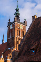 Wall Mural - Gothic Church of St. Catherine in Gdansk Ancient architecture of old town in Gdansk Poland. Beautiful and colorful old houses historical part of downtown. Travel destination. Tourist attraction