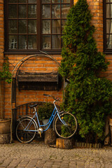 Wall Mural - Bicycle parked as decoration in Ancient architecture of old town in Gdansk Poland. Beautiful and colorful old houses historical part of downtown. Travel destination. Tourist attraction