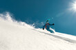 © cppzone - Very fast skier rides over ski slope. Freeride concept