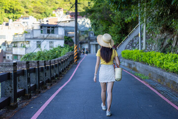 Canvas Print - Woman walk on road in countryside