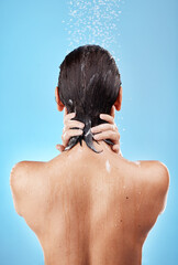 Sticker - Back, shower and woman hygiene, wellness and body care for health, skincare and against blue studio background. Clean, female and girl wet, natural beauty and water splash to relax and washing.