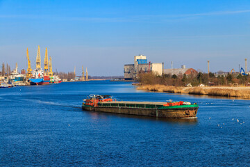 Barge sailing on the Oder river in Szczecin, Poland