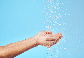 Sticker - Shower, water and hands of a woman cleaning, saving and catching liquid against blue studio background. Sustainability, wellness and person with care for body, grooming and hygiene with mockup space