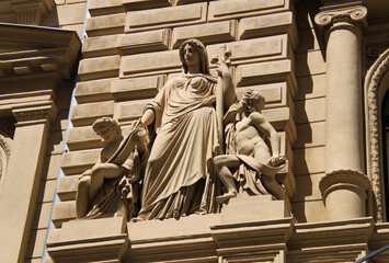 Exterior view of a historical building in the old town of Budapest, Hungary, Europe. Statues, columns, and beautiful ornaments on the facade of a historical house.