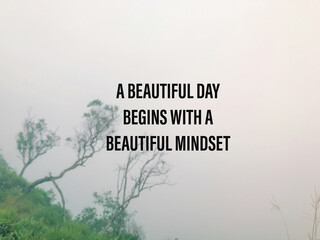 Wall Mural - Motivational and inspirational wording. A beautiful day begins with a beautiful mindset. Written on blurred styled background.