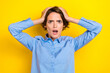 Closeup photo of young attractive cute angry woman wear blue shirt office boss deadline hands hold head nervous deadline isolated on yellow color background
