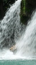 Panning Footage, Close Up Of Waterfalls Cascading Down Into A Pool, Vertical