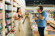 © AntonioDiaz - Upset woman looking angry with a noisy customer at the bookstore