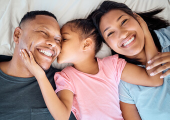 Top view, kiss and black family with girl on bed, smile and happy for bonding, loving and together. Portrait, love and mother with father, daughter and happiness to connect, in bedroom and embrace