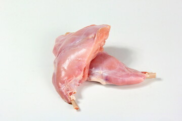 Two raw rabbit legs with bone on a white background