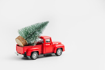 Wall Mural - Miniature red car with Christmas tree. Winter cute landscape. Cozy small world. Christmas decorations, holiday concept. Merry Christmas!