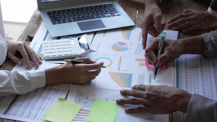 Wall Mural - Asian business adviser meeting to analyze and discuss the situation on the financial report in the meeting room.Investment Consultant,Financial Consultant,Financial advisor and accounting concept