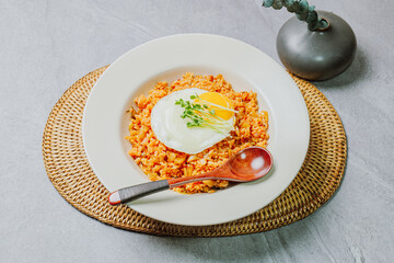 Wall Mural - Kimchibokkeumbap, Korean Kimchi Fried Rice : Rice fried with finely chopped kimchi. Beef, pork, onions, green onions, and other vegetables may be added according to taste.