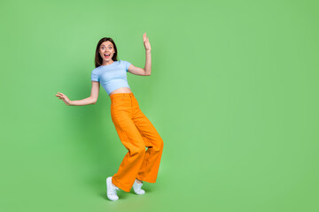 Wall Mural - full length portrait of positive pretty person stand tip toe impressed reaction empty space isolated