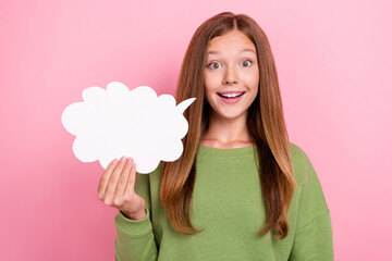 Sticker - Photo of impressed funky school girl dressed green sweatshirt holding speaking bubble empty space isolated pink color background