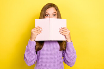 Wall Mural - Photo of afraid scared lady hold planner book cover her face hide eyes avoid ignore teacher question isolated on yellow color background