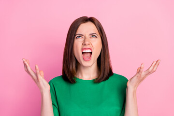 Sticker - Photo of young funny unhappy woman agressive look up screaming small salary isolated on pink color background