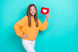 Photo of young excited popular teenager blogger hold red paper heart notification like her instagram account isolated on cyan color background