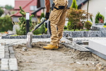 Wall Mural - Contractor Laying a Brick Paving Path