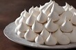 Closeup of meringues on a white plate