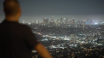 Sticker - Guy enjoying the beautiful view of the cityscape lights in Los Angeles, California 