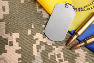 Wall Mural - Military ID tag, bullets and Ukrainian flag on pixel camouflage, flat lay. Space for text