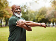© M Einero/peopleimages.com - Senior fitness, exercise and black man stretching outdoor at park for energy, health and wellness in retirement. Portrait, face and smile of male in nature for workout, cardio and training in summer