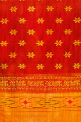 Wall Mural - Handmade Indian sari / saree with golden details, woman wear on festival, ceremony and weddings, expensive sarees are famous for their gold and silver zari, brocade. Incredible India.