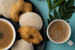 south indian food called idli vada sambar or sambar vada or wada, served with coconut chutney and south indian style hot coffee