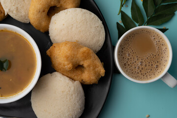 Wall Mural - south indian food called idli vada sambar or sambar vada or wada, served with coconut chutney and south indian style hot coffee