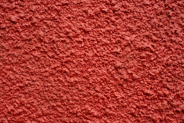 Wall Mural - Home facade texture. Rough surface. Grunge grain. Crushed rocks in the wall. Exterior home decoration. Stucco wall pattern. Red color retro design. Noisy design background.