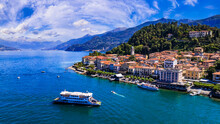 One Of The Most Beautiful Lakes Of Italy - Lago Di Como. Aerial Panoramic View Of Beautiful Bellagio Village And Ferryboat.  Popular Tourist Destination