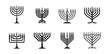 © garikprost - Bundle silhouette Hanukkah menorah icons for Jewish festival of lights vector illustration
