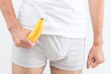 Man Holding A Banana Fruit Gun In His Trousers