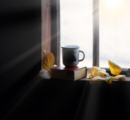 Wall Mural - Coffee mug and book on windowsill