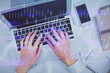 © peshkova - Double exposure of woman hands working on computer and forex chart hologram drawing. Top View. Financial analysis concept.
