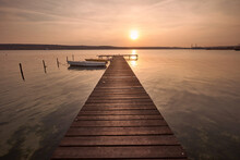 Landscape Photo Of A Jetty And Boats On Lake At Sunset In Varna, Bulgaria.