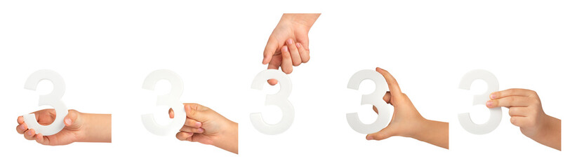 Aufkleber - number three in hand isolated on black background. Number three in a child's hand on a black background. A great set to insert into a project or design