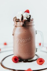 Canvas Print - Closeup shot of an appetizing raspberry chocolate milkshake