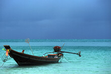 A Long Tail Fishing Boat In The Turquoise Gulf Of Thailand.